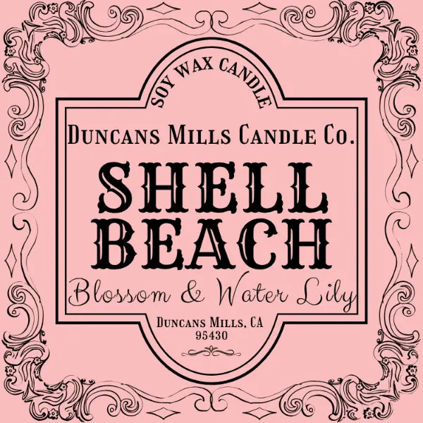 Shell Beach candle label with blossom and water lily notes on pink background by Duncans Mills Candle Co.