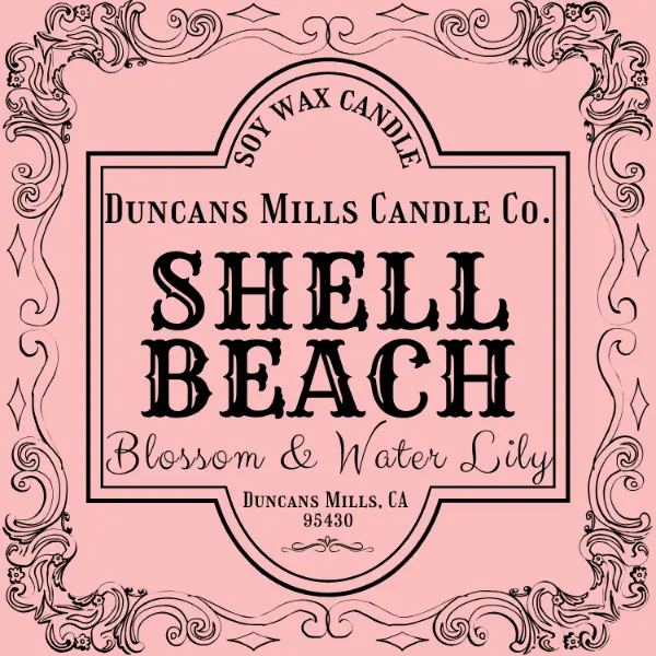 Label for Duncans Mills Candle Co. Shell Beach candle on a pink background with decorative border.