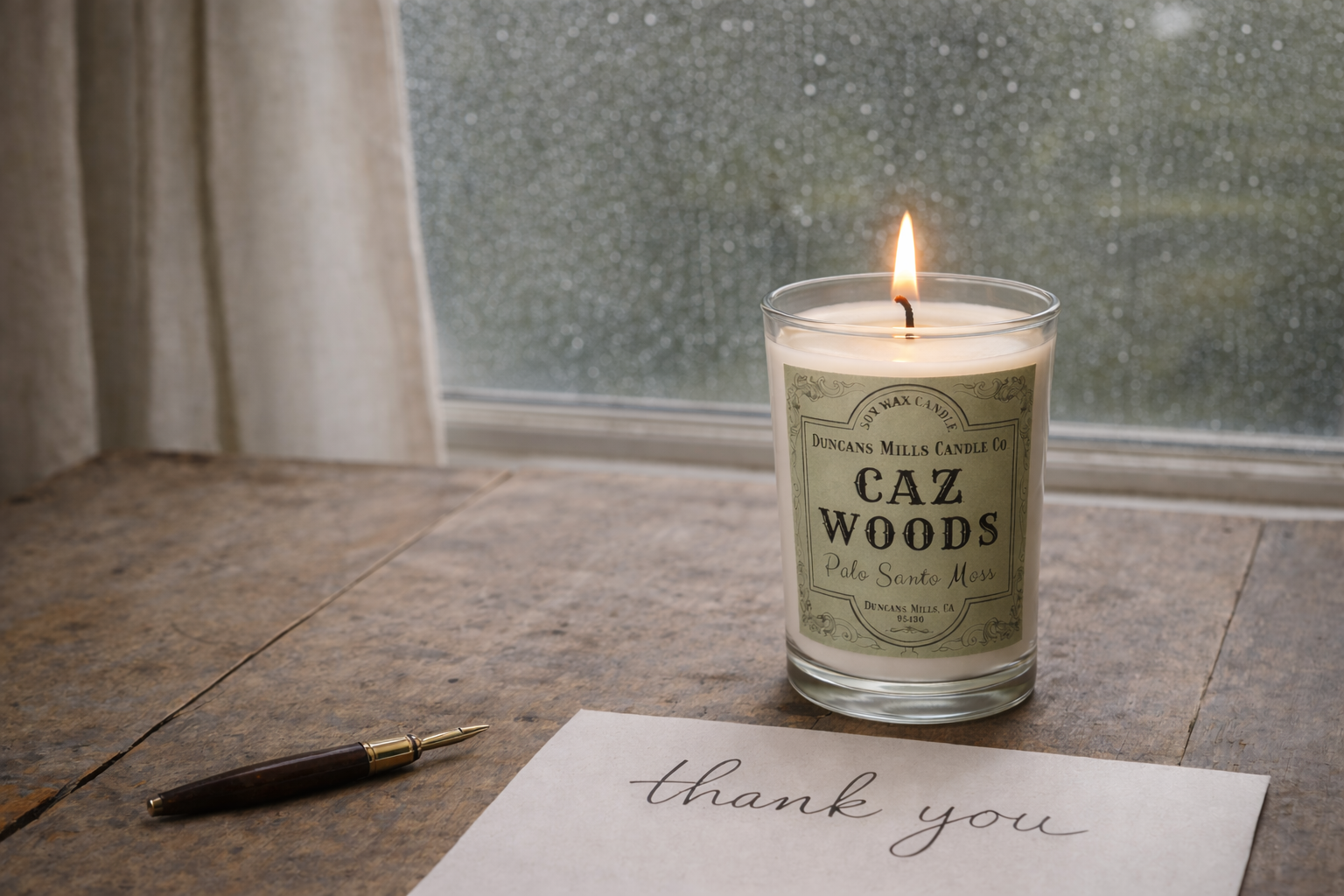 Caz Woods Cafe Glass burning on a table with a thank you note on a rainy afternoon.