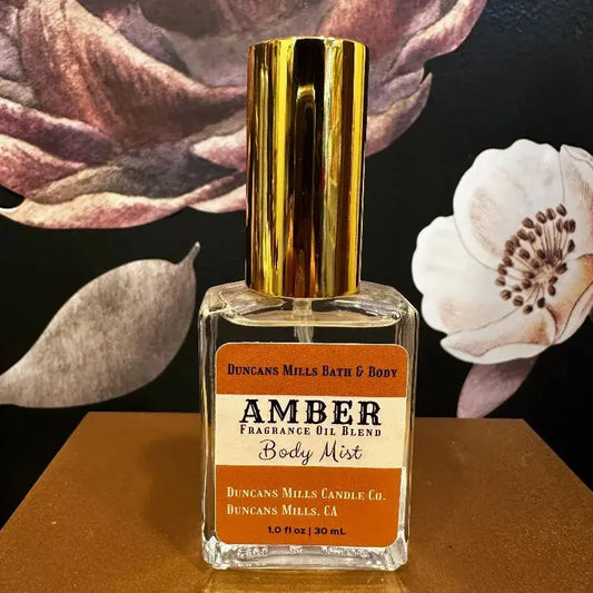 Amber body mist eau de toilette with warm amber notes in glass bottle by Duncans Mills Bath & Body