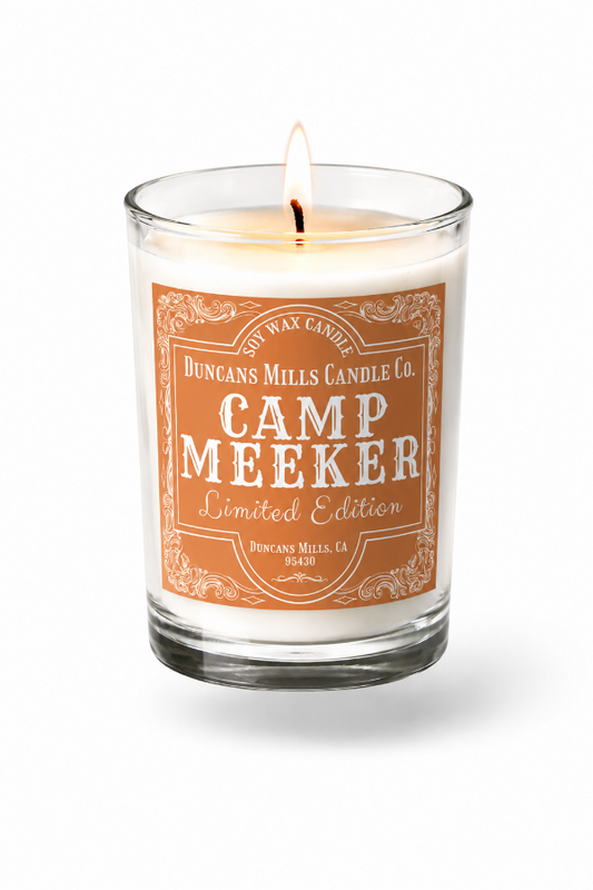 Candle with 'Camp Meeker' label on a white background