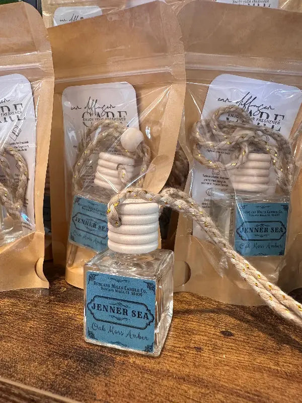 Jenner Sea Car Diffuser, offering an elegant scent of oakmoss, amber, and sage in a compact format for small spaces like cars, lockers, and dorm rooms.