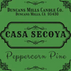 Casa Secoya Peppercorn Pine candle label with Duncans Mills Candle Co. branding on a green background.