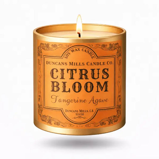 Candle in a decorative tin labeled 'Citrus Bloom' by Duncans Mills Candle Co.