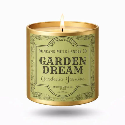 Candle in a tin labeled 'Garden Dream' from Duncans Mills Candle Co. on a white background