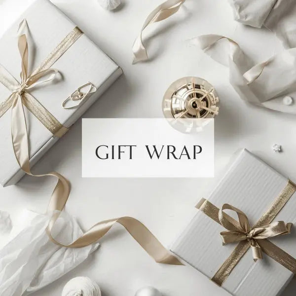 Gift wrap with white boxes tied with gold ribbons on a light background
