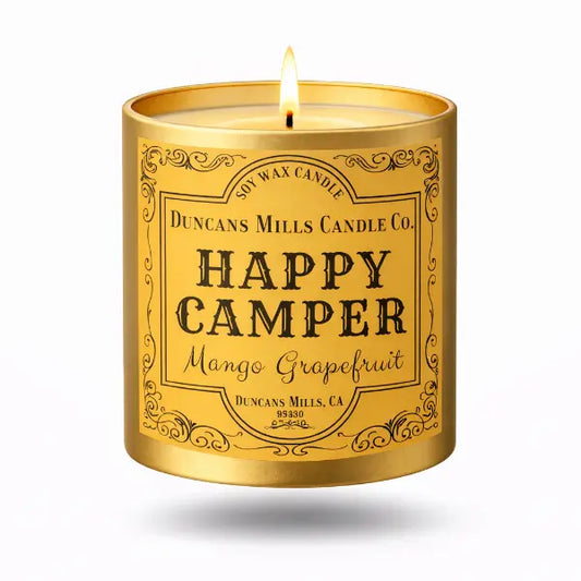 Gold candle tin with 'Happy Camper' label on a white background