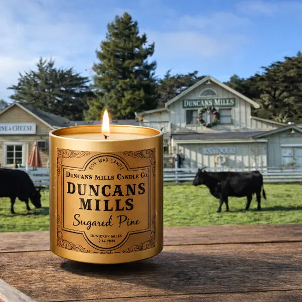 Duncans Mills infinity tin candle photographed with the historic village in the background