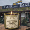 Gold Coast Coffee candle in front of Gold Coast Coffee and Bakery