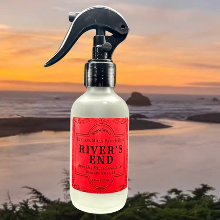 A bottle of River’s End Room & Linen Spray with a background overlooking the meeting point of the Russian River and the Pacific Ocean. The scent blends crisp sea salt air with soft floral notes for a refreshing, elegant ambiance.