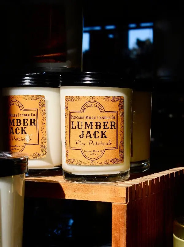 Lumberjack soy wax candle with pine and patchouli notes in gold tin by Duncans Mills Candle Co.