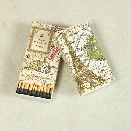 Long, wooden, black-tipped matches in a box showing part of a map of Paris, with the label 