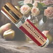 Moonflower Rose Rollerball Perfume displayed with fresh pear and blooming roses  evoking its celestial and enchanting fragrance.