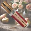 Moonflower Rose Rollerball Perfume displayed with fresh pear and blooming roses  evoking its celestial and enchanting fragrance.