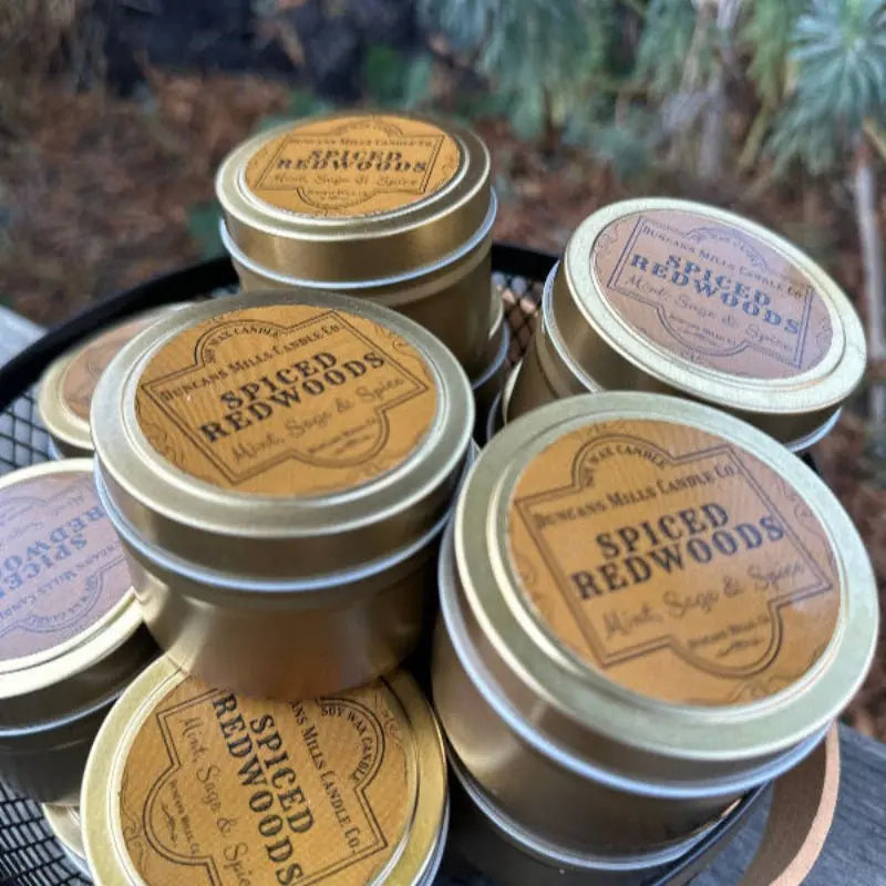 Spiced Redwoods soy wax candle with mint, sage and spice notes in gold tin by Duncans Mills Candle Co.