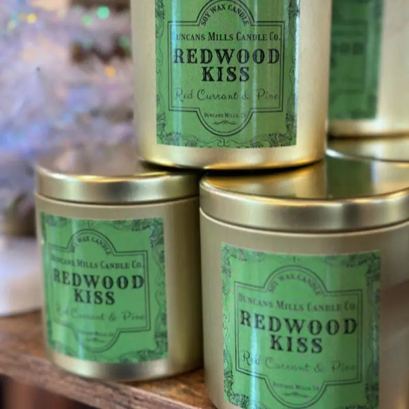 Redwood Kiss soy wax candle with red currant and pine notes in gold tin by Duncans Mills Candle Co.