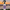 Spray bottle with 'River's Edge' label against a sunset beach backdrop