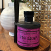 A bottle of Fig Leaf Reed Diffuser with natural reeds, evoking a lush fig tree surrounded by moss, green leaves, and delicate floral notes.