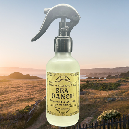 Sea Ranch Room & Linen Spray in a frosted glass bottle with a fine mist sprayer, featuring a fresh and earthy scent of spruce, wild sage, and cypress. Handcrafted in small batches in Duncans Mills, California.