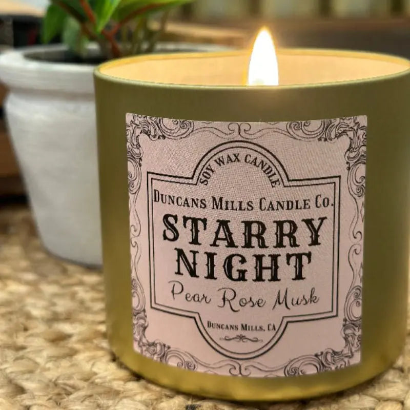 Starry Night soy wax candle with pear, rose and musk in gold tin by Duncans Mills Candle Co.