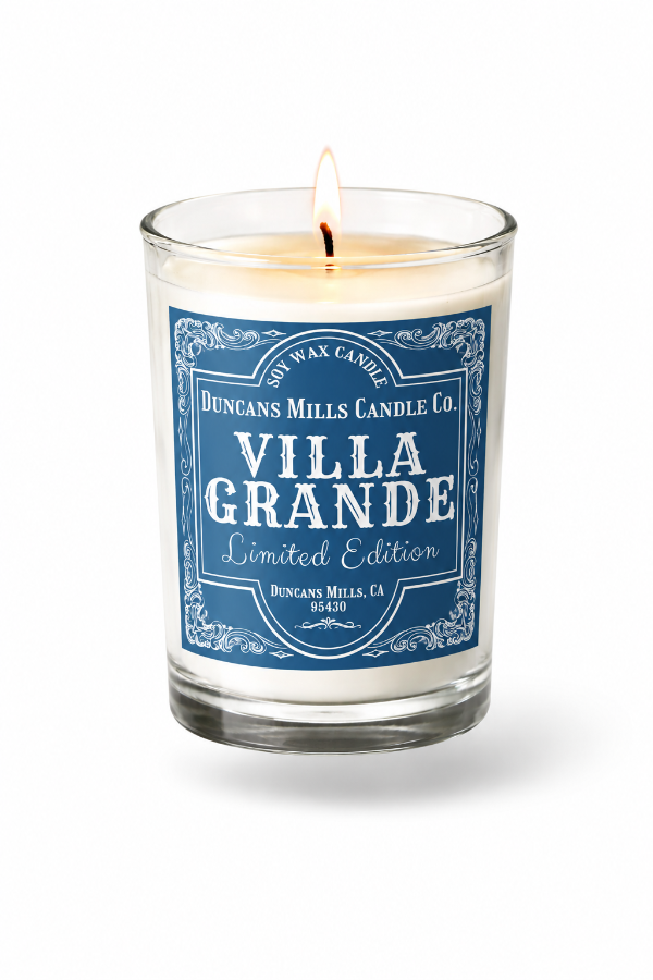 Candle with a blue Villa Grande label on a white background