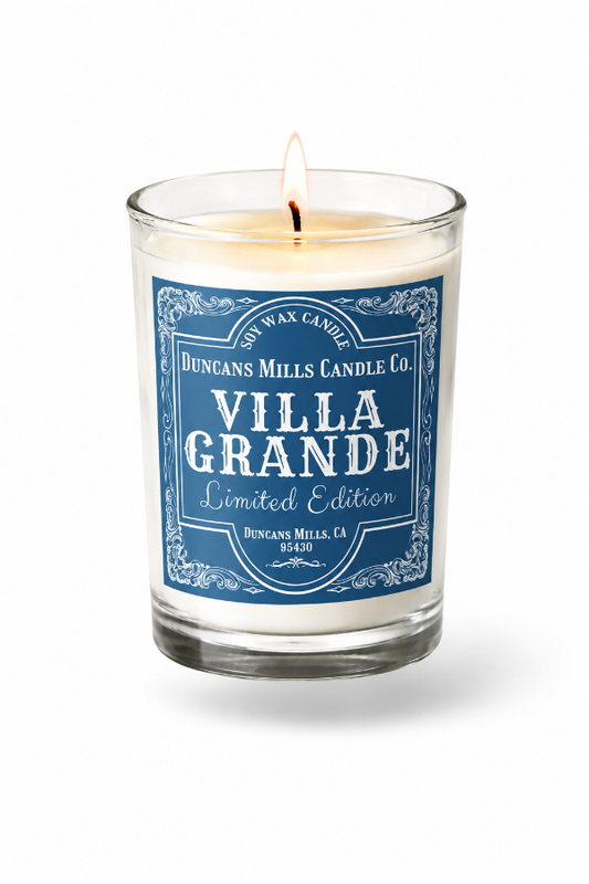 Candle with a blue Villa Grande label on a white background