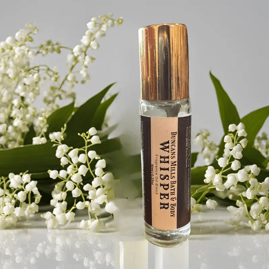 Whisper rollerball perfume with soft amber and musk in glass bottle by Duncans Mills Candle Co.
